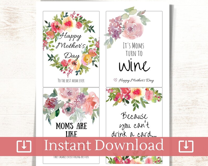 May include: Four printable wine bottle labels with floral designs and Mother's Day messages. The labels feature the text "Happy Mother's Day", "It's Moms Turn to Wine", "Moms Are Like...", and "Because You Can't Drink a Card..."
