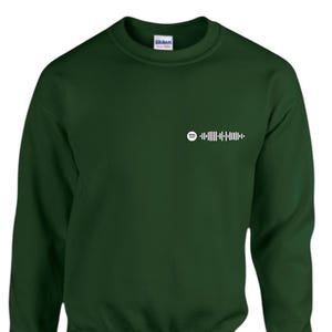 May include: A dark green sweatshirt with a white Spotify code graphic on the upper left chest. The sweatshirt is a solid color and has a crew neck design.