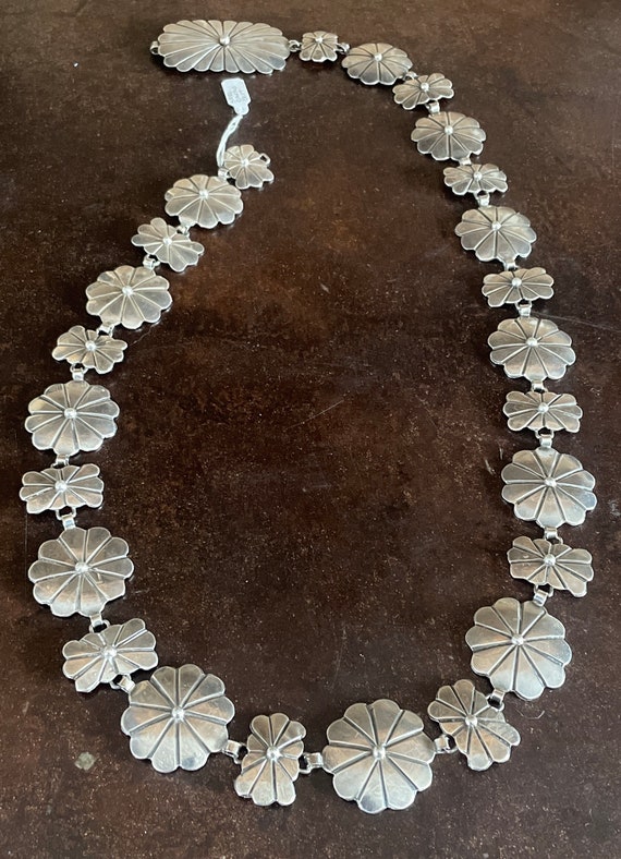 Silver floral conch belt