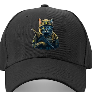 May include: A black baseball cap with a graphic of a cat wearing a military uniform and holding a rifle. The cat has blue eyes and a yellow and blue helmet with a Ukrainian trident symbol.