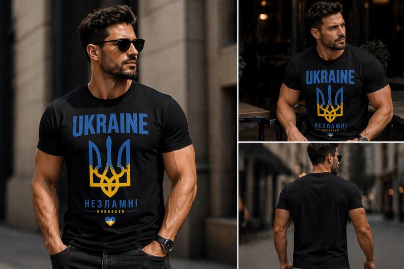 Op de afbeelding: Zwart T-shirt met het woord "UKRAINE" in blauw, boven een blauw en geel drietandsymbool. Daaronder staat het woord "НЕЗЛАМНІ" in wit, met een kleine hartafbeelding. Het T-shirt wordt door een persoon gedragen.