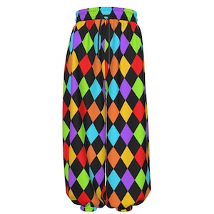 May include: Loose-fitting pants featuring a vibrant harlequin diamond pattern in black, red, yellow, green, blue, and purple. The garment includes an elasticized waistband with a black drawstring and elastic cuffs at the bottom of each pant leg.