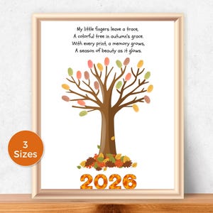 May include: A framed print featuring a brown tree trunk with colorful fingerprint leaves, a pile of autumn leaves at the base, and the text: My little fingers leave a trace, A colorful tree in autumn's grace. With every print, a memory grows, A season of beauty as it glows. 2026.