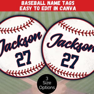 May include: Two circular baseball-themed name tags featuring the name Jackson and the number 27 in dark blue script and block font. The design includes red stitching details on a white background. Text at the top reads BASEBALL NAME TAGS EASY TO EDIT IN CANVA.