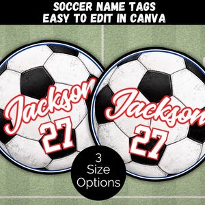 May include: Two circular soccer ball name tags featuring a black and white soccer ball pattern. Each tag displays the name Jackson in a red script font above the number 27 in a red block font with a white outline. The text SOCCER NAME TAGS EASY TO EDIT IN CANVA appears at the top, and 3 SIZE OPTIONS is at the bottom.