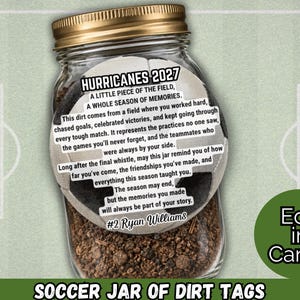 May include: A clear glass jar with a gold metal lid filled with dark brown soil. A circular tag shaped like a football is attached, featuring the text HURRICANES 2027, A LITTLE PIECE OF THE FIELD, A WHOLE SEASON OF MEMORIES, and #2 Ryan Williams.