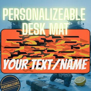 May include: Personalizable desk mat with an orange camouflage pattern. The mat features the text "YOUR TEXT/NAME" in white. A circular badge with the word "PERSONALIZABLE" is in the lower left corner.