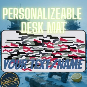 May include: A rectangular desk mat with a camouflage pattern in black, gray, red, and white. The mat has the text "PERSONALIZABLE DESK MAT" at the top and "YOUR TEXT/NAME" at the bottom. A circular badge reads "PERSONALIZABLE".