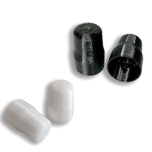 May include: Two white and two black plastic caps. The white caps are cylindrical and the black caps are slightly conical.