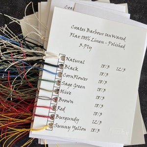 May include: A white card with a list of thread colors and their corresponding numbers. The colors include natural, black, cornflower, sage green, olive, brown, red, burgundy, and sunny yellow. The card is labeled "Coates Barbour Unwaxed Flax 100% Linen - Polished 3-Ply".