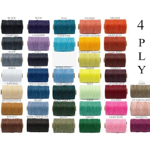 May include: A collection of 30 spools of 4-ply twine in various colors, including black, plum, teal, salmon, and orange. Each spool is labeled with its color name. The image displays a wide range of hues, from light to dark.