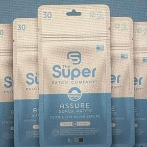 May include: A collection of Assure Super Patch packages from The Super Patch Company. Each package is a vertical rectangle with a blue and beige color scheme. The text "ASSURE SUPER PATCH" is visible, along with the number "30".