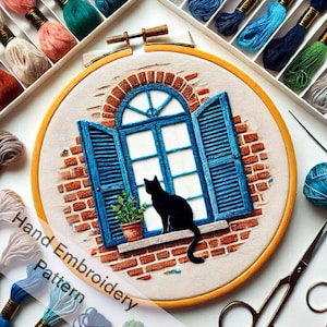 May include: Hand embroidery pattern featuring a black cat sitting on a windowsill with blue shutters. The window is arched and has a brick wall behind it. The embroidery is framed in a wooden hoop.