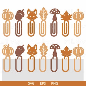 May include: A collection of fall-themed paper clips in shades of brown and orange. Designs include pumpkins, acorns, foxes, leaves, and mushrooms. The paper clips are arranged in two rows, perfect for stationery and craft projects.