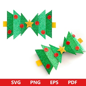 May include: Two green glitter Christmas tree decorations with red and yellow accents. The decorations are shaped like a bow and a single tree.