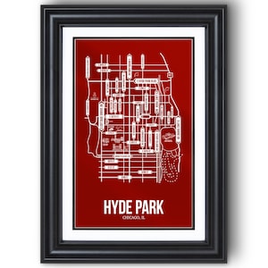 May include: Framed print of a map of Hyde Park, Chicago, in white on a red background. The map details streets and landmarks, with the text "HYDE PARK" and "CHICAGO, IL" at the bottom. The frame is black.