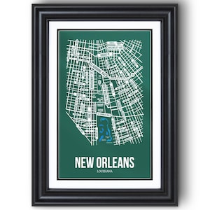 May include: Framed print of a map of New Orleans, Louisiana. The map is white on a dark green background, with street names and a blue area representing a body of water. The words "NEW ORLEANS" and "LOUISIANA" are printed at the bottom.