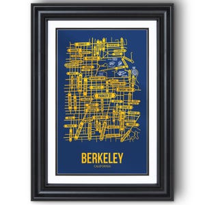 May include: Framed art print depicting a map of Berkeley, California. The artwork has a navy blue backdrop with yellow street names and directional arrows. The word "Berkeley" is displayed in large yellow letters at the bottom.