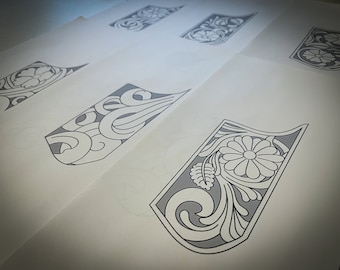 May include: Five different designs for leather tooling, each featuring a stylized floral pattern with a central flower.