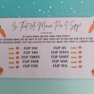May include: A white card game titled "Is That A Mince Pie I Spy?" with illustrations of carrots and mince pies. The text describes a coin flip game with instructions and point values. The card is on a teal background.