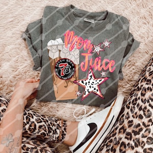 May include: A gray t-shirt with a pink and white graphic of a coffee cup with the text "Mom Juice" and a star with a leopard print design.