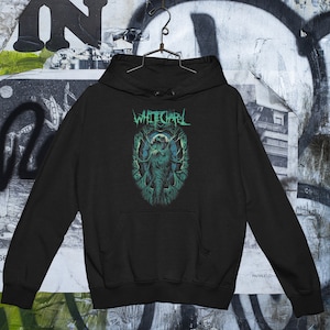 May include: Black hooded sweatshirt with a green and white graphic print of a creature with the text "Whitechapel" above it.