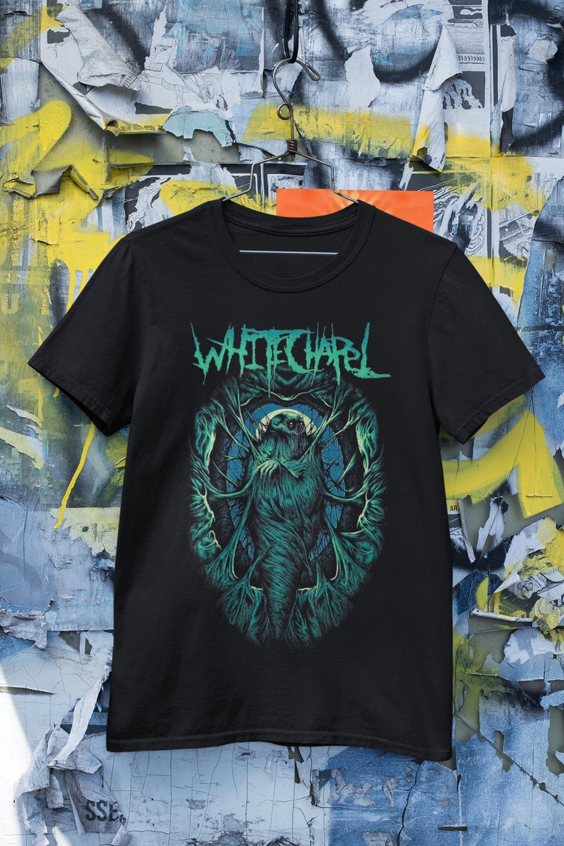 May include: Black t-shirt with a green and white graphic of a creature with the band name "Whitechapel" printed in white.