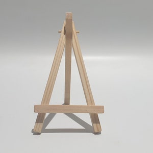 Mini wooden easel(s) 15cm high x 8cm wide. Package  weight = 25g each.