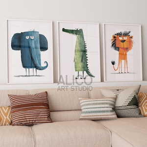 May include: Three framed illustrations of cartoon animals. The first illustration is of a blue elephant with a sad expression. The second illustration is of a green crocodile with a toothy grin. The third illustration is of an orange lion with a grumpy expression.