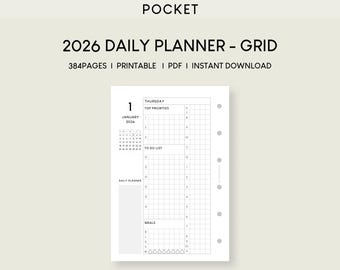 May include: A white 2026 daily planner grid page with the text "POCKET" at the top. The page includes sections for "Top Priorities", "To Do List", and "Meals". The date "January 1, 2026" is displayed prominently.