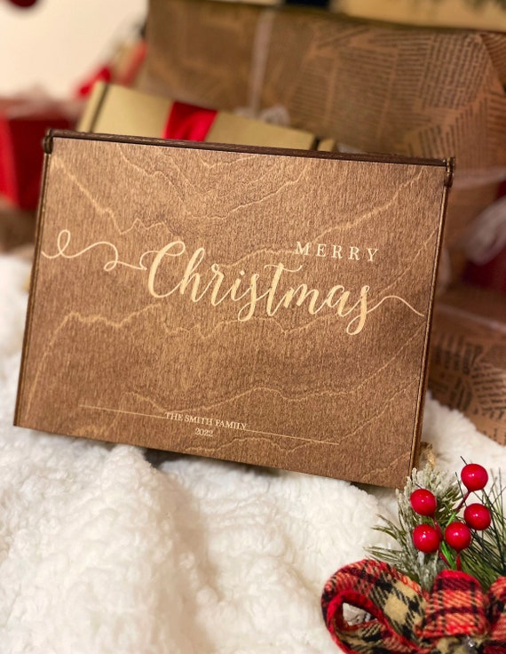 A personalized wooden keepsake photo box with 54 favorites and real gift-giving gravity — custom-engraved and the kind of present people actually tear up over.