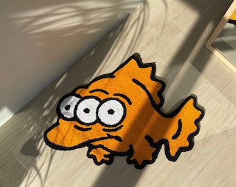 Tapis poisson à trois yeux : décoration de chambre d'enfant inspirée des dessins animés