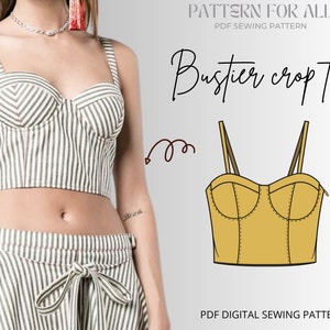 May include: A digital sewing pattern for a bustier crop top. The pattern is illustrated in yellow and features a sweetheart neckline, boning, and adjustable straps. The text "Bustier crop top" is written in black cursive.