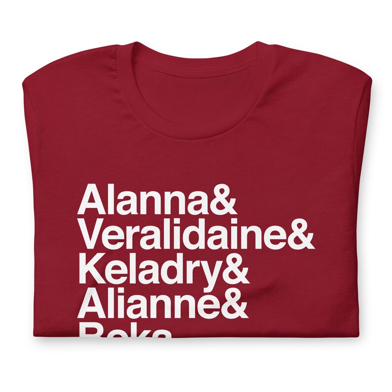 red variety of tamora pierce custom shirt with white helvetica text, left aligned, listing vertically characters names from top to bottom: allana &, veralidiane &, keladry &, alianna &, beka