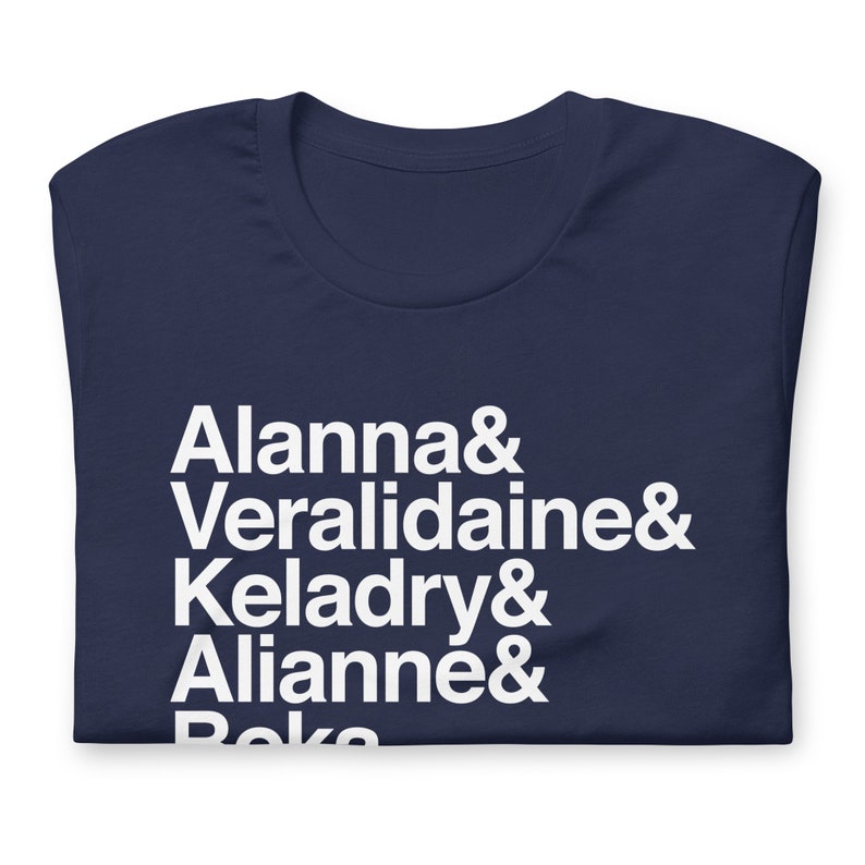 navy blue variety of tamper pierce custom shirt with white helvetica text, left aligned, listing vertically characters names from top to bottom: allana &, veralidiane &, keladry &, alianna &, beka