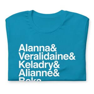 light blue variety of tamara pierce custom shirt with white helvetica text, left aligned, listing vertically characters names from top to bottom: allana &, veralidiane &, keladry &, alianna &, beka
