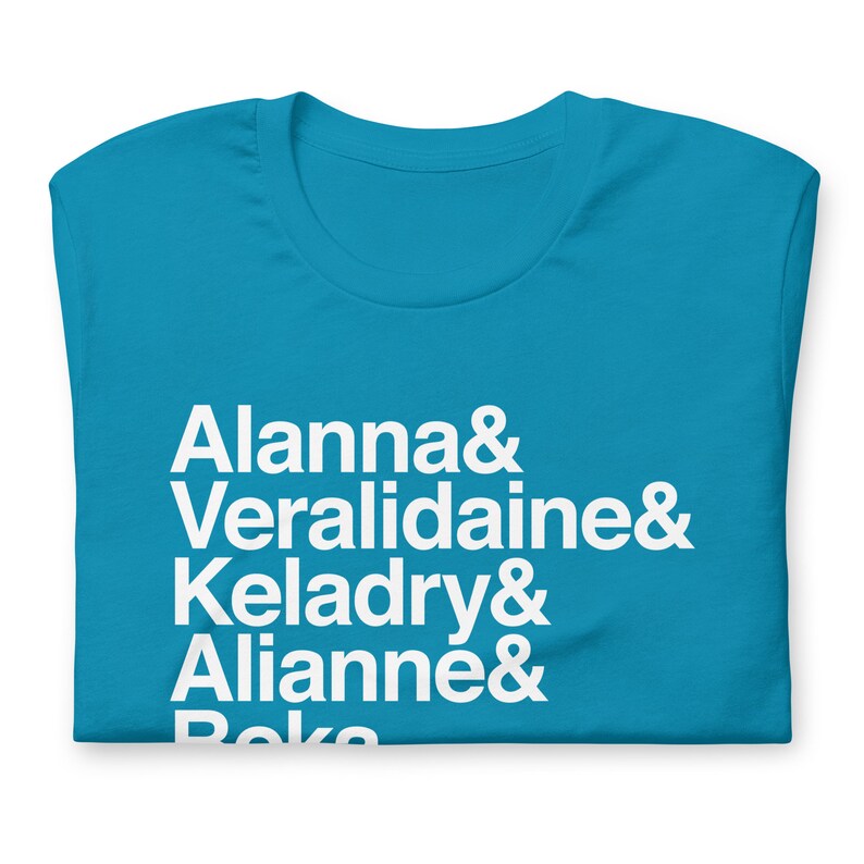 light blue variety of tamara pierce custom shirt with white helvetica text, left aligned, listing vertically characters names from top to bottom: allana &, veralidiane &, keladry &, alianna &, beka