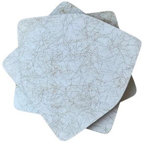 May include: A stack of three star-shaped coasters. The coasters have a light blue background with a pattern of thin, brown, intersecting lines. The edges of the coasters are rounded.