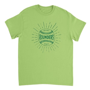 May include: A lime green short-sleeve t-shirt featuring a dark green graphic of a baseball with the text "HACKNEY ROUNDERS DOWNS" printed in the center. The design includes radiating lines around the ball, creating a sunburst effect on the chest.