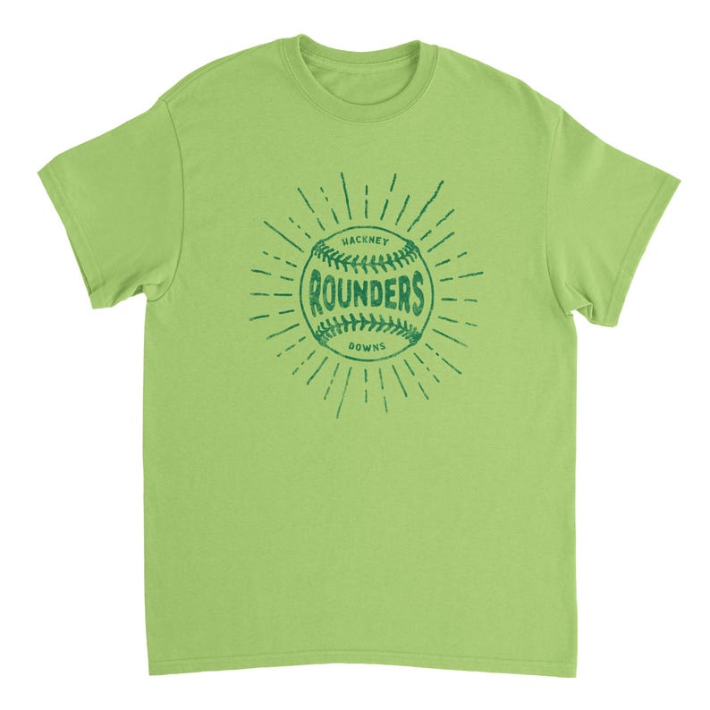 May include: A lime green short-sleeve t-shirt featuring a dark green graphic of a baseball with the text "HACKNEY ROUNDERS DOWNS" printed in the center. The design includes radiating lines around the ball, creating a sunburst effect on the chest.
