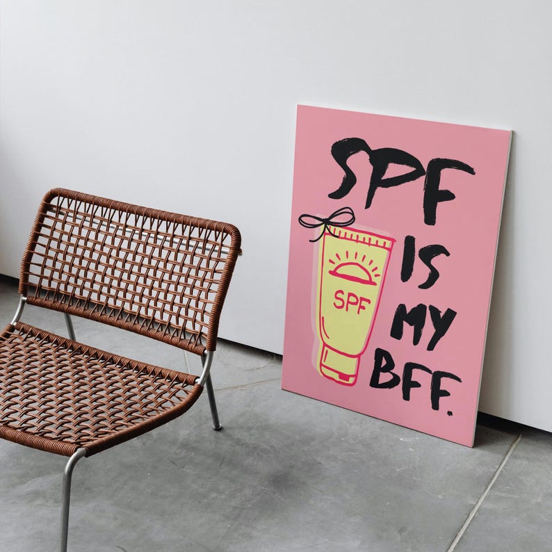 May include: Pink canvas print with a black and white illustration of a tube of sunscreen with the text "SPF is my BFF."