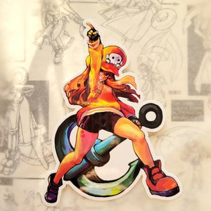 May include: A colorful sticker featuring a cartoon character with long brown hair, wearing a yellow and red jacket, black shorts, and a skull-shaped hat. The character is standing on a large, blue anchor.