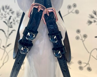 Patent english leather spur straps with rose gold buckles