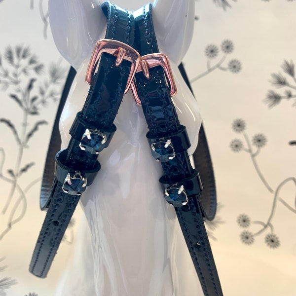 Patent english leather spur straps with rose gold buckles