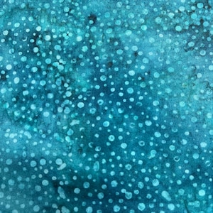 May include: Teal fabric with a white polka dot pattern. The dots are of varying sizes and are randomly scattered across the fabric.