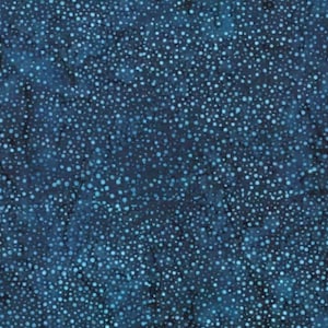May include: Dark blue fabric featuring a speckled pattern of small, light blue and white dots. The fabric has a mottled appearance, with variations in the dark blue background. The overall effect resembles a starry night sky.