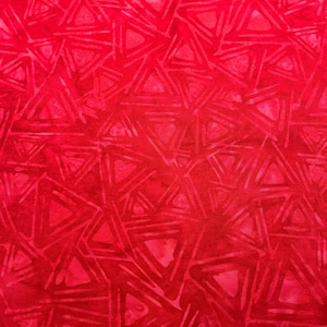 May include: A vibrant red fabric with a repeating pattern of interconnected triangles. The design features varying shades of red, creating a textured and dynamic visual effect. This textile is suitable for various crafting and sewing projects.