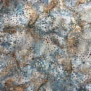 May include: A blue and brown fabric with a white background and a pattern of small gold dots.