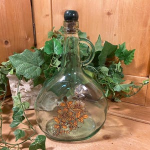Vintage Green Glass Wine Jug with Brown Floral  | Floral Glass Liquor Bottle with Finger Loop Handle | 1970s Table Decor | Wine Bottle Art