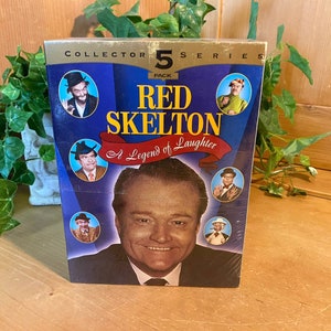 May include: A blue and gold DVD box set featuring a 5-pack of Red Skelton: A Legend of Laughter. The box features a photo of Red Skelton and several smaller photos of him in various comedic roles.